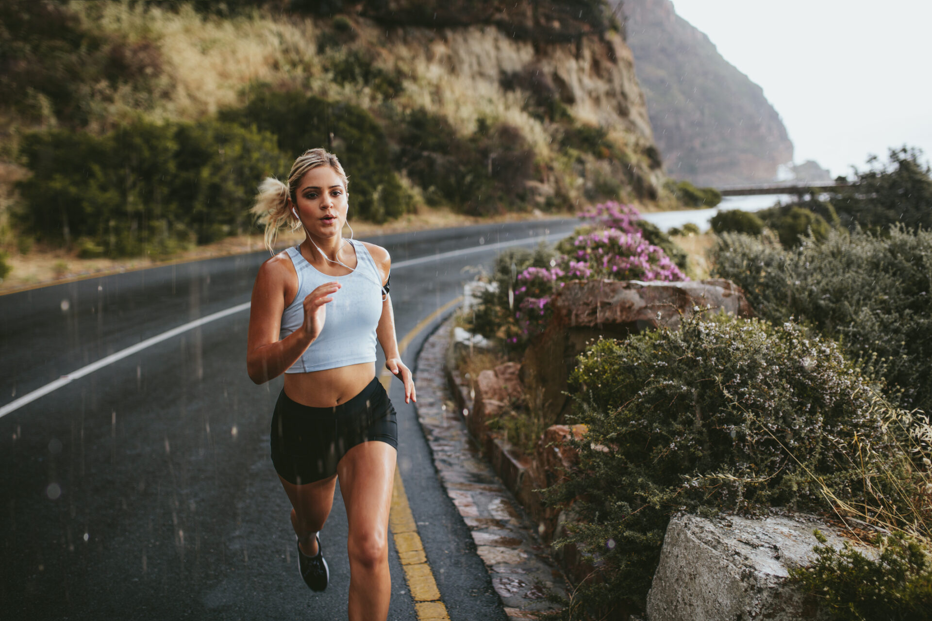 Fitness woman running on highway