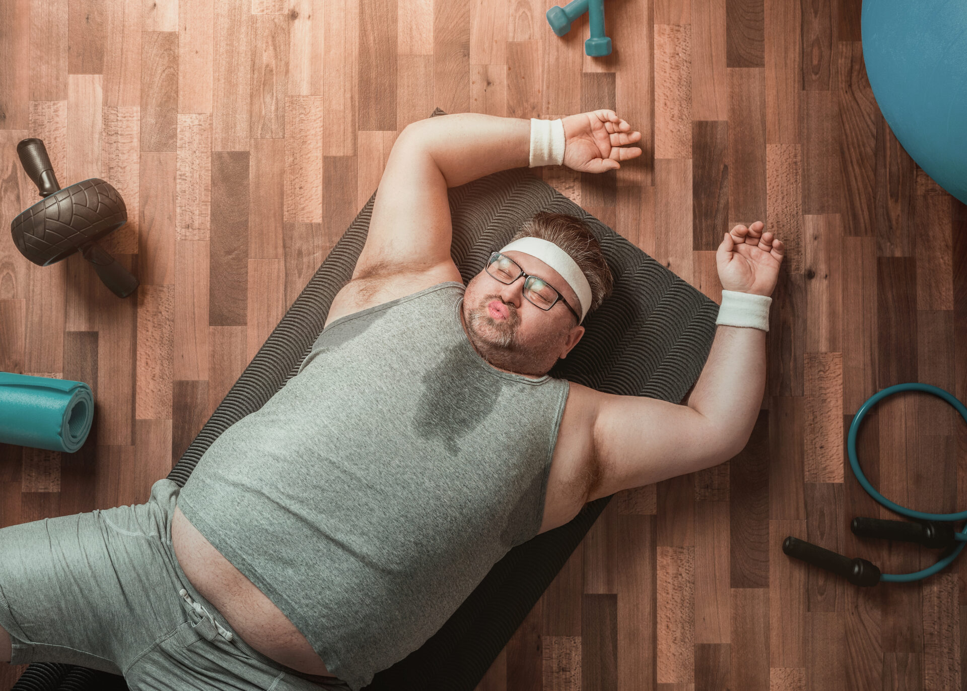 Funny exhausted overweight sportsman